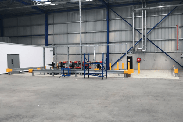 Warehouse safety setup with line marking, bollards and barriers Warehouse safety setup with line marking, bollards and barriers