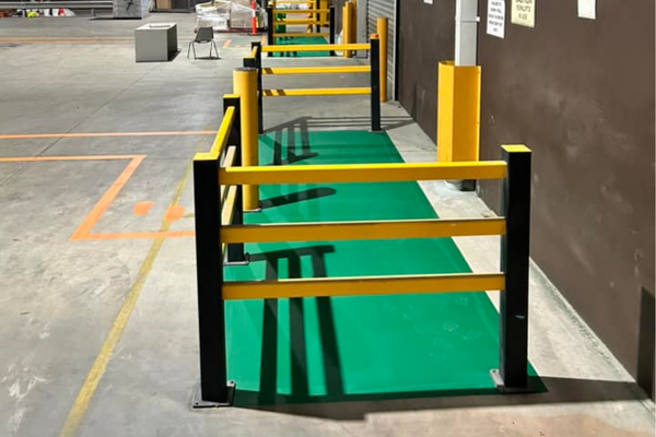 Warehouse safety setup with line marking, bollards and barriers Warehouse safety setup with line marking, bollards and barriers